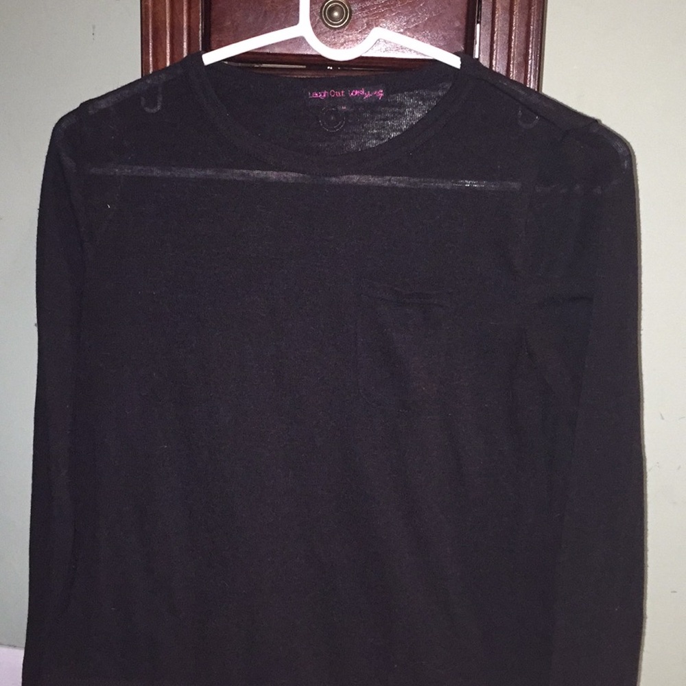 A long sleeve black shirt with a pocket